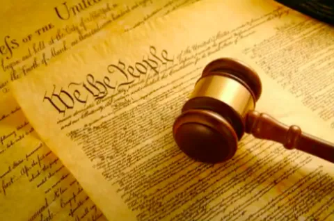 Picture of the Preamble of the United States Constitution with a gavel. 